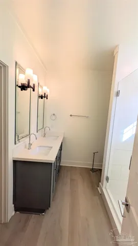a view of a bathroom with a sink and mirror