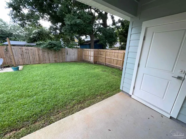 a view of a backyard with tree s