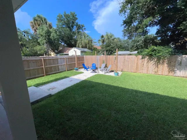 a view of a backyard with a slide