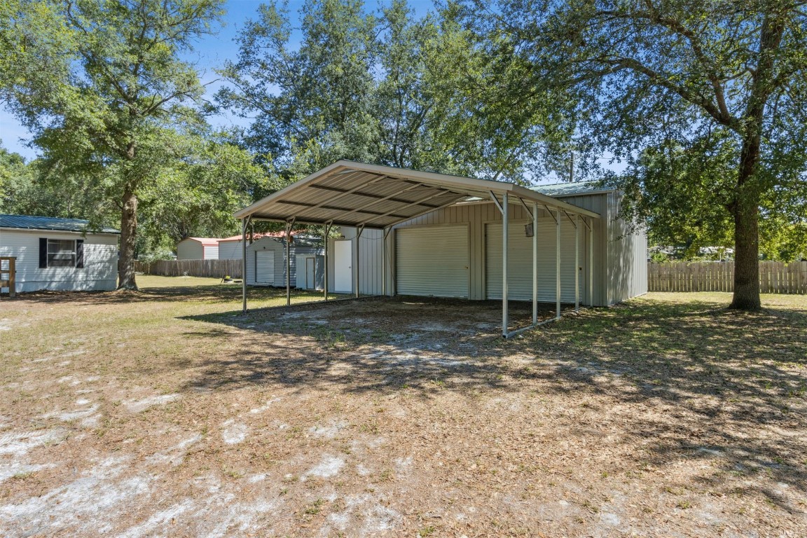 85323 Rose Marie Road Yulee, FL 32097 - Photo 5 of 42 24x35 metal garage with 2 roll up doors and entry door