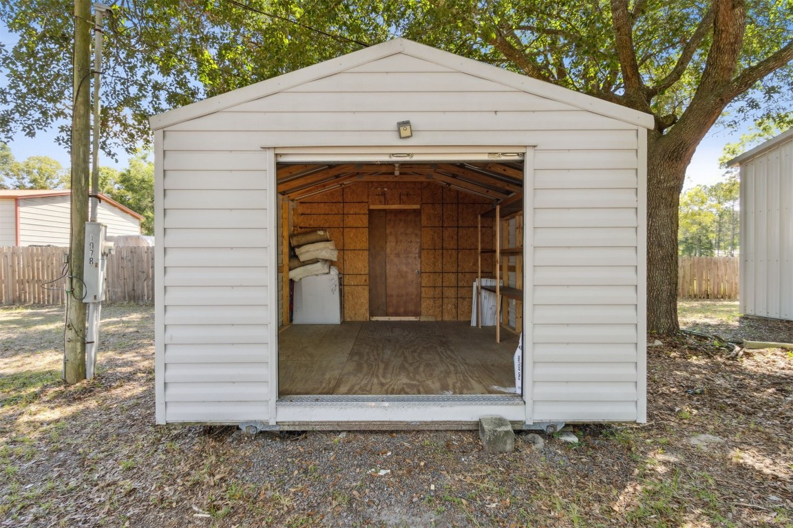 85323 Rose Marie Road Yulee, FL 32097 - Photo 8 of 42 11x20 shed with hidden area that is air conditioned