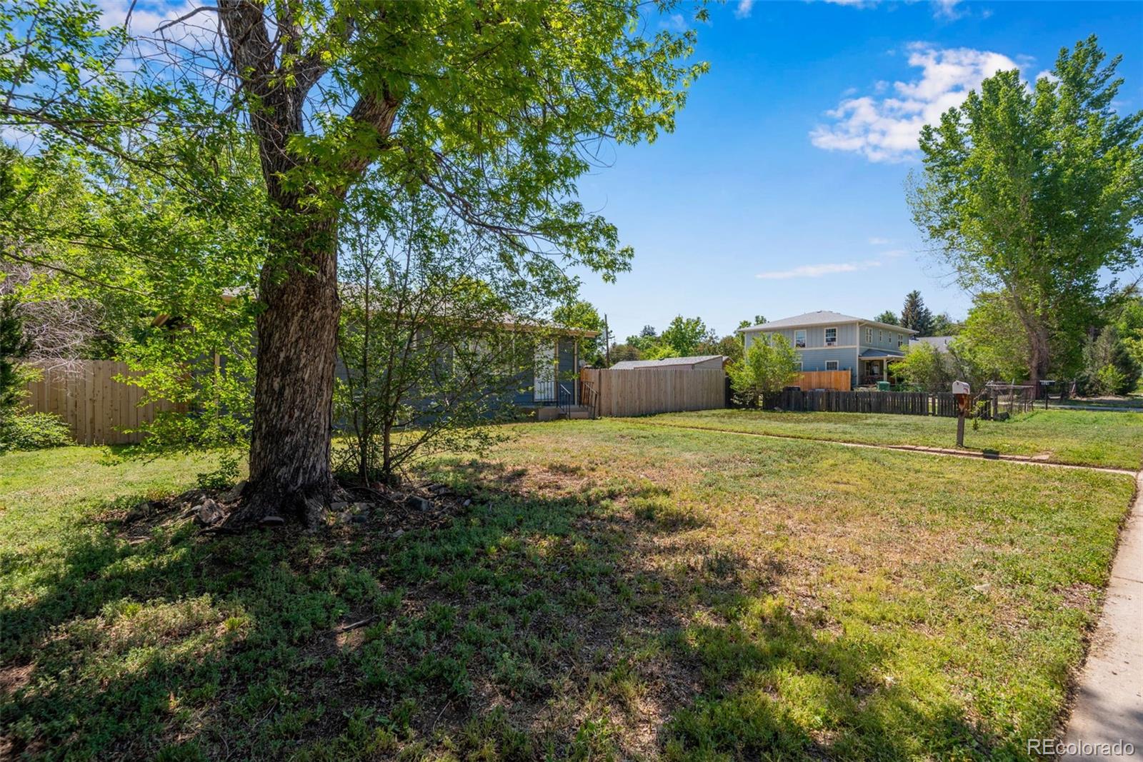 934 Linley Court Denver, CO 80204 - Photo 3 of 17 a view of a field with large trees