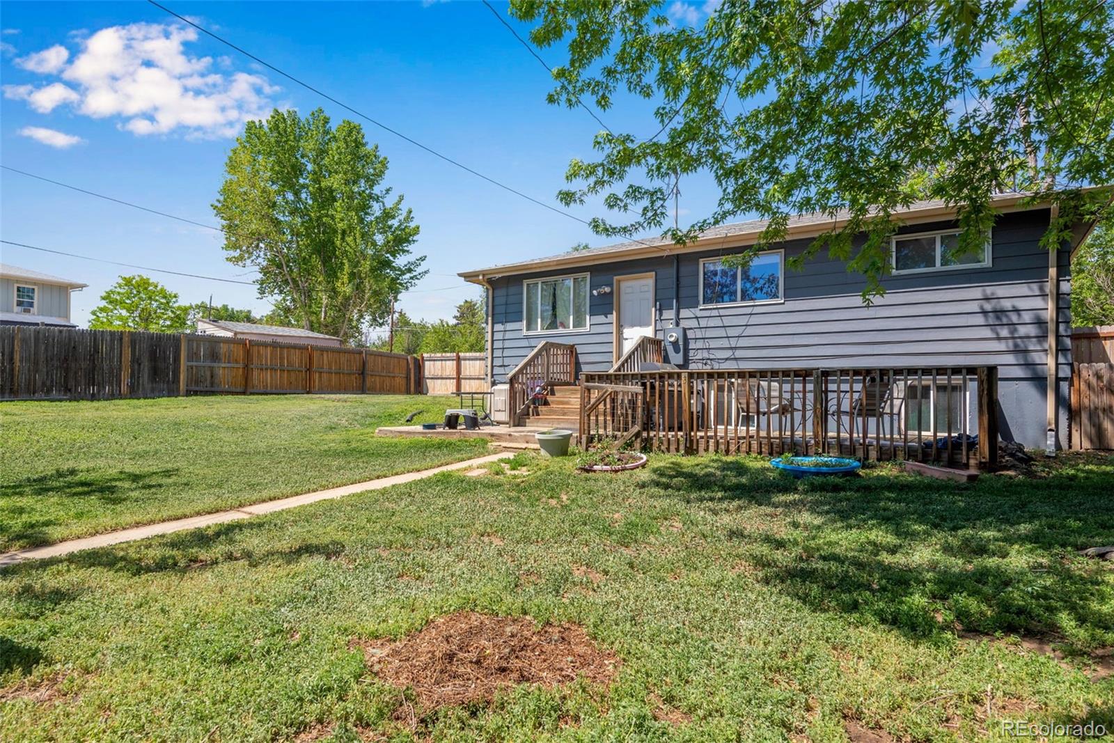 934 Linley Court Denver, CO 80204 - Photo 4 of 17 a view of a house with a yard