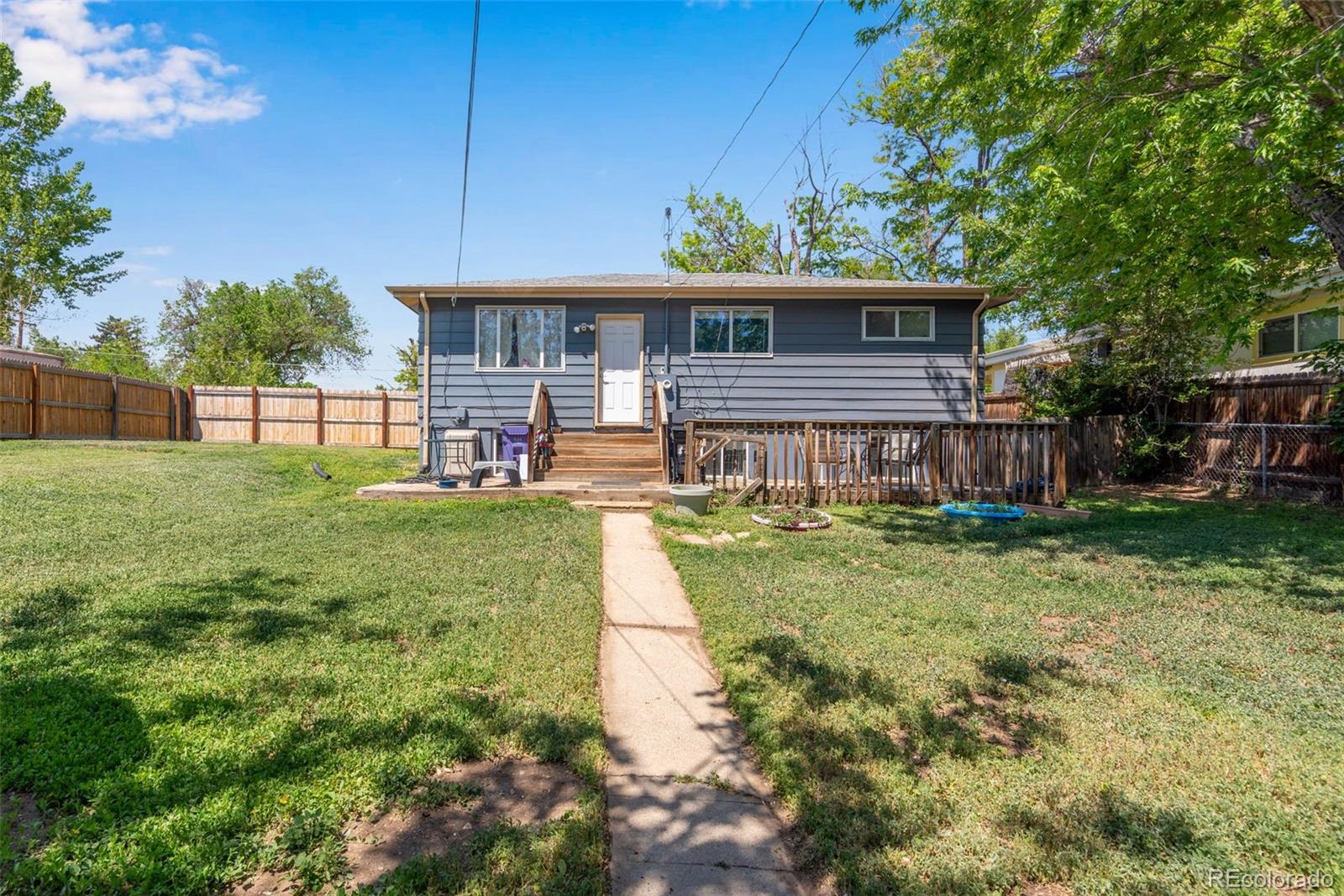 934 Linley Court Denver, CO 80204 - Photo 5 of 17 a front view of house with yard and green space