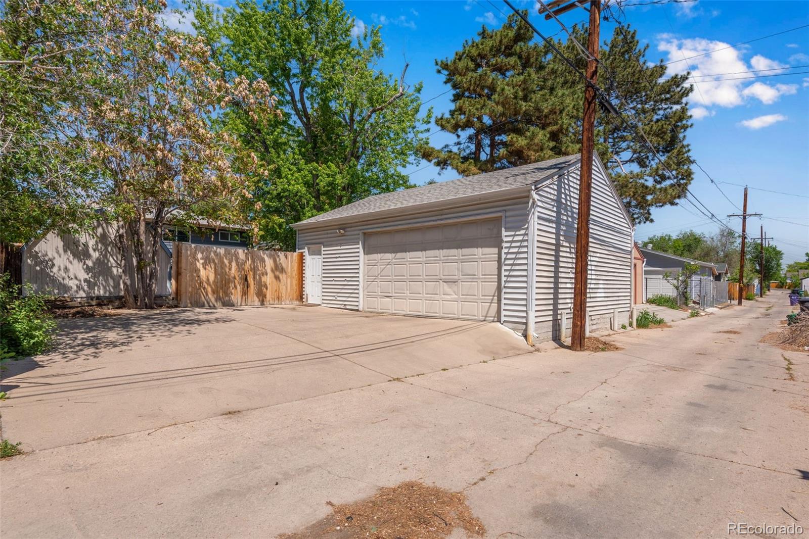 934 Linley Court Denver, CO 80204 - Photo 10 of 17 a front view of a house with a yard and garage