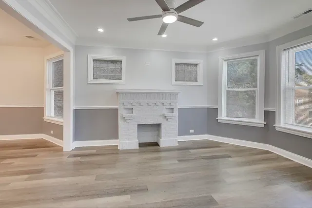 a living room with a fireplace and a window
