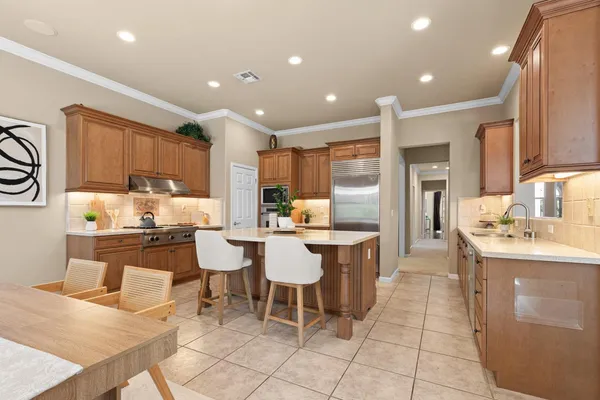 a kitchen with a sink and a large window