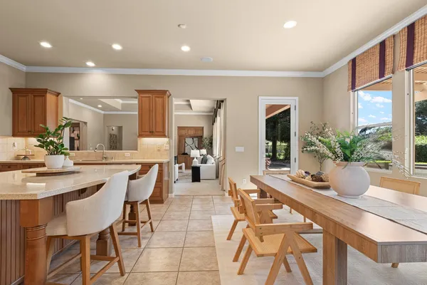 a kitchen with stainless steel appliances granite countertop a sink a stove and a refrigerator