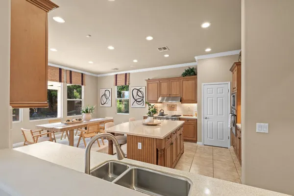 a kitchen with a sink and cabinets