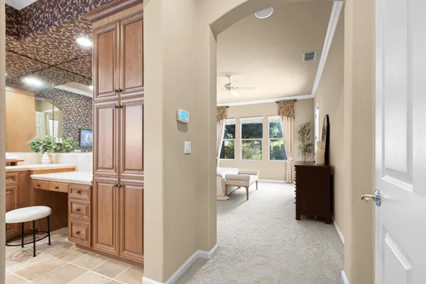 a bathroom with a sink toilet and a mirror