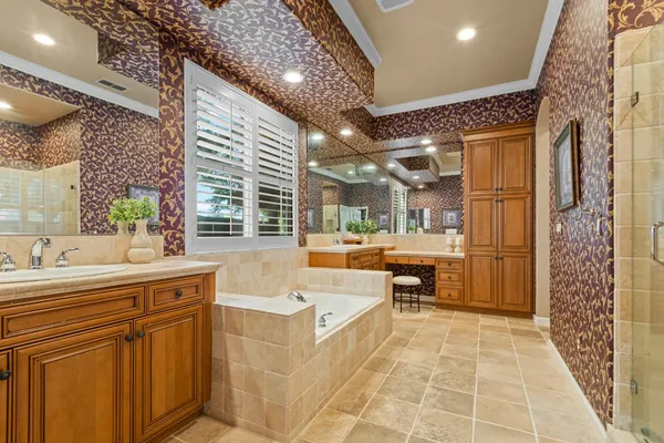 a kitchen with a sink cabinets and a wooden floor