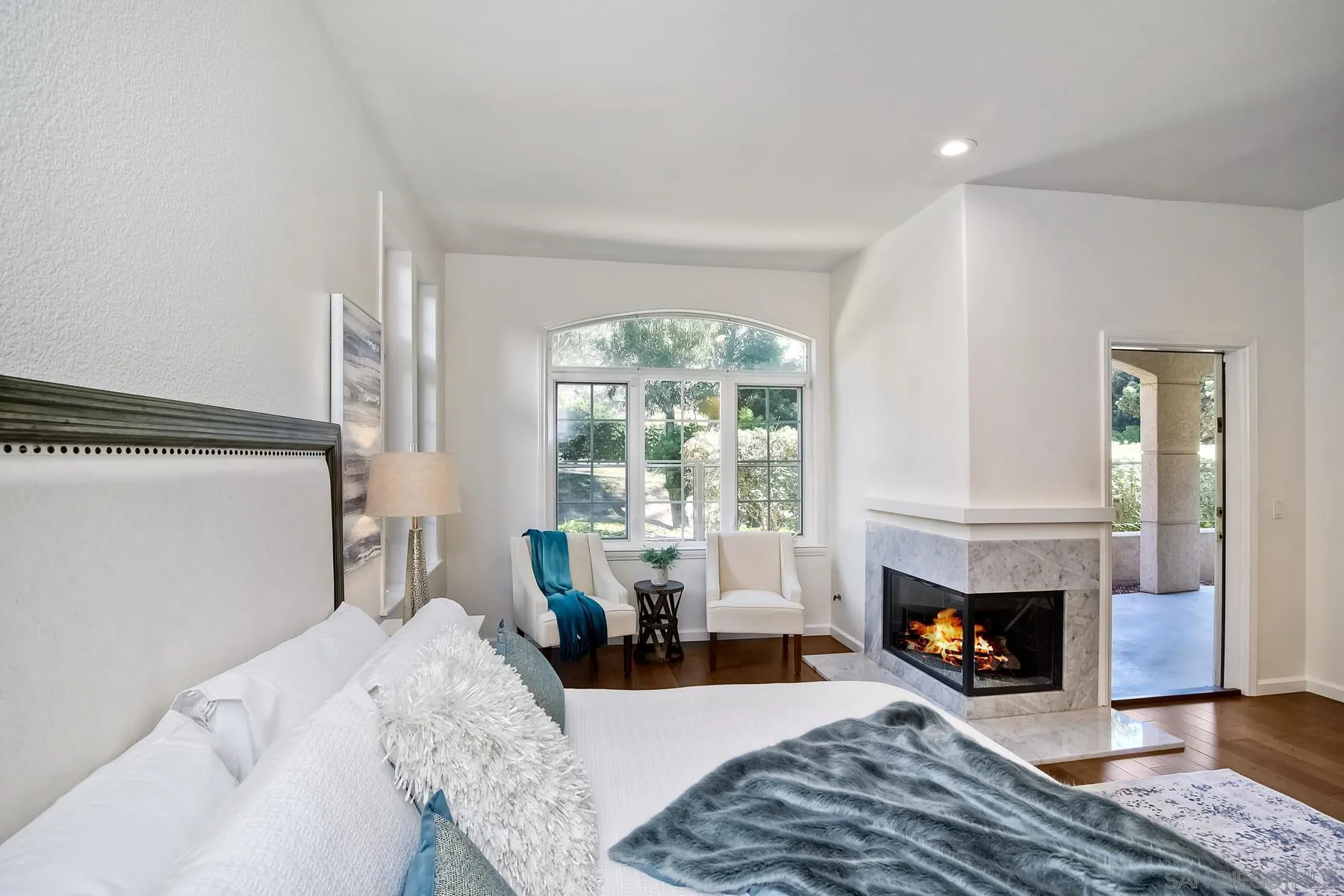 2872 Torrey Pines Road La Jolla, CA 92037 - Photo 18 of 34 a living room with furniture a window and a fireplace