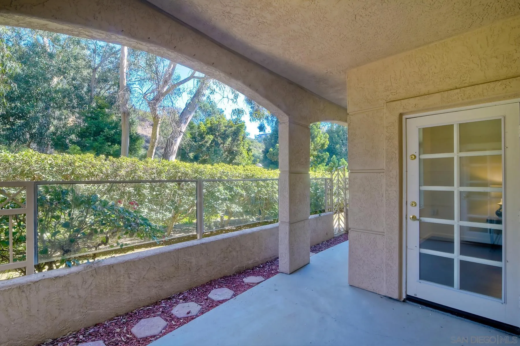 2872 Torrey Pines Road La Jolla, CA 92037 - Photo 19 of 34 an empty room with wooden floor and windows