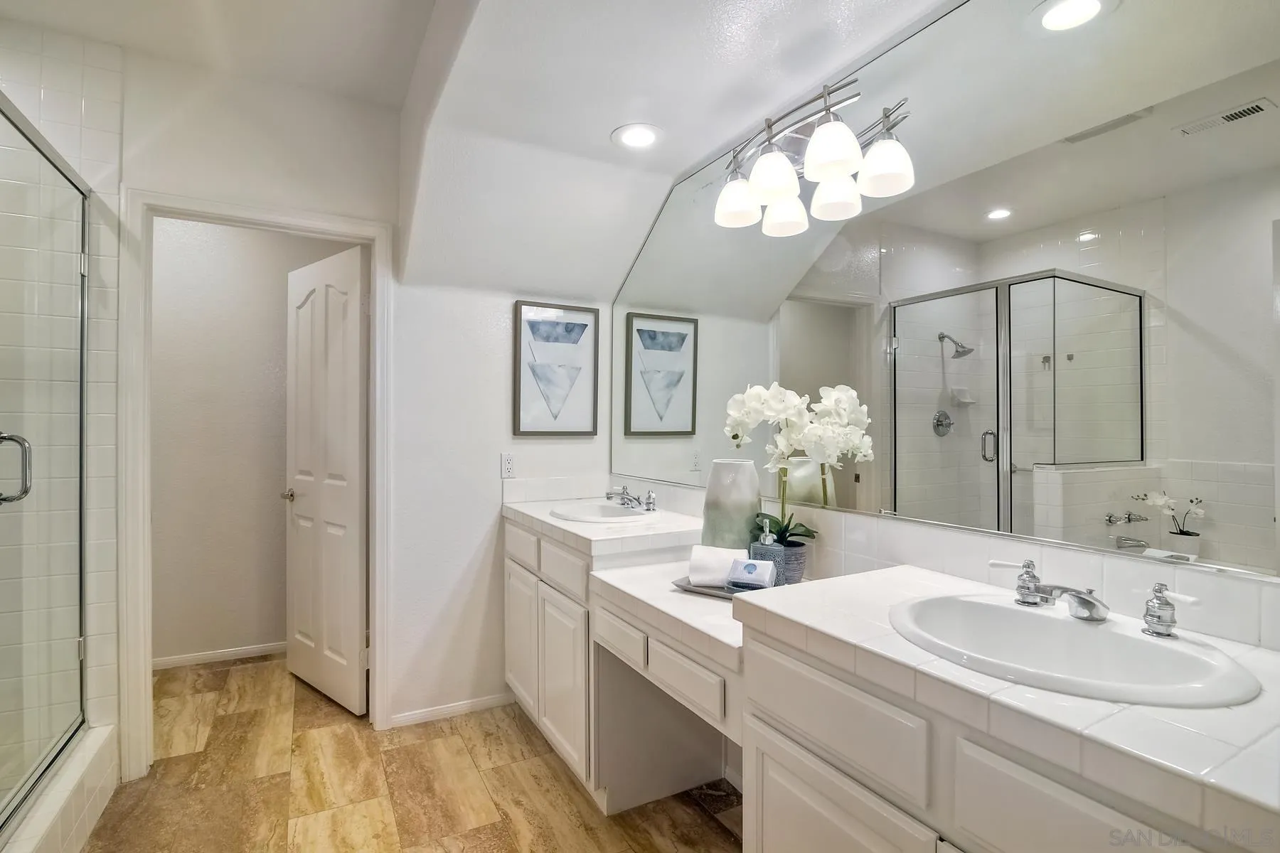 2872 Torrey Pines Road La Jolla, CA 92037 - Photo 27 of 34 a bathroom with a sink mirror and vanity