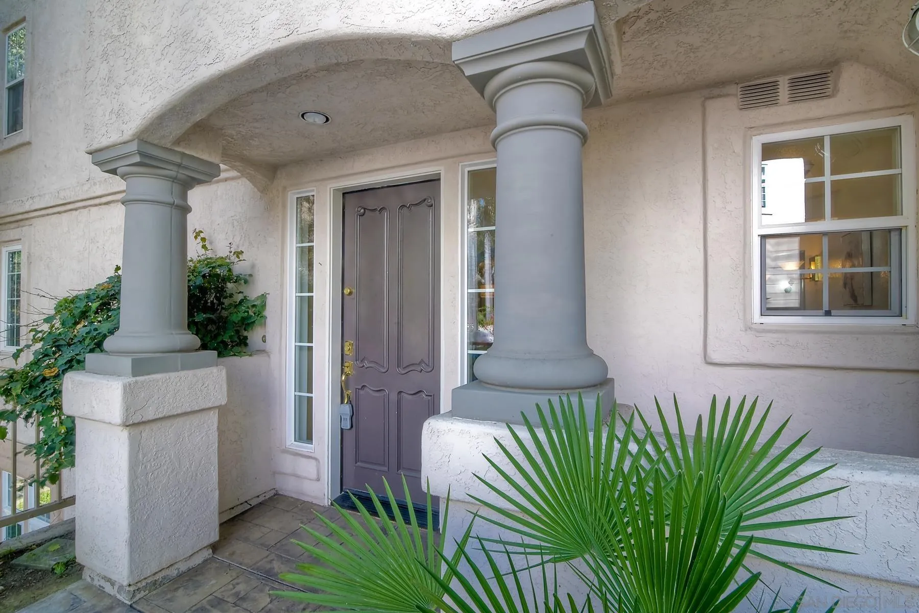 2872 Torrey Pines Road La Jolla, CA 92037 - Photo 3 of 34 a potted plant sitting in front of a house
