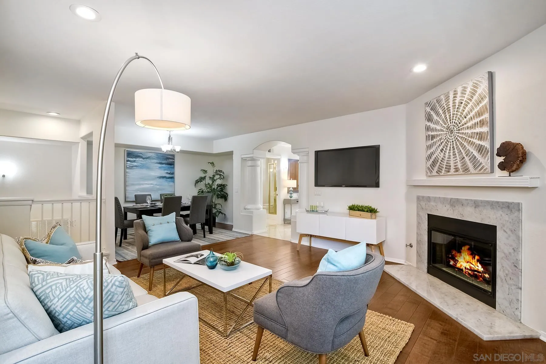 2872 Torrey Pines Road La Jolla, CA 92037 - Photo 5 of 34 a living room with furniture a flat screen tv and a fireplace