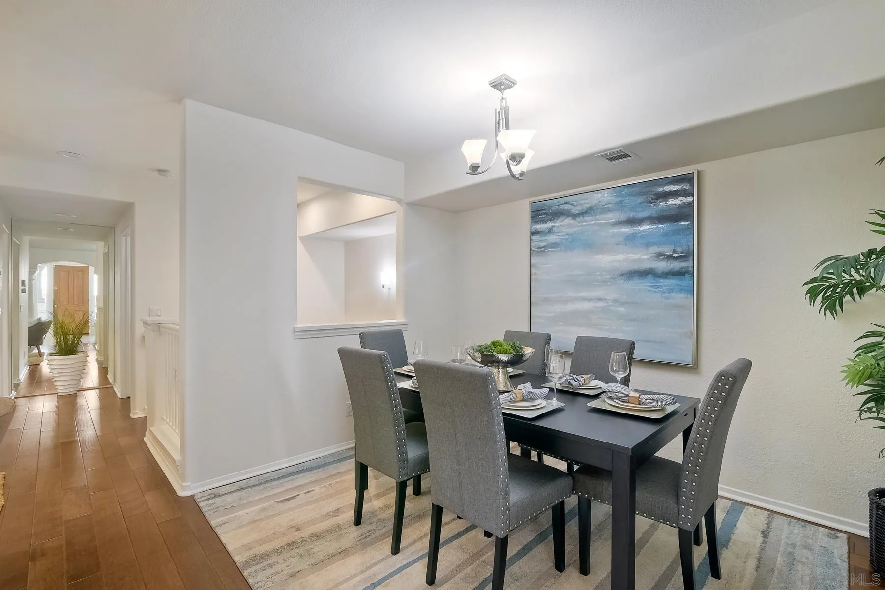 2872 Torrey Pines Road La Jolla, CA 92037 - Photo 6 of 34 a view of a dining room with furniture and wooden floor