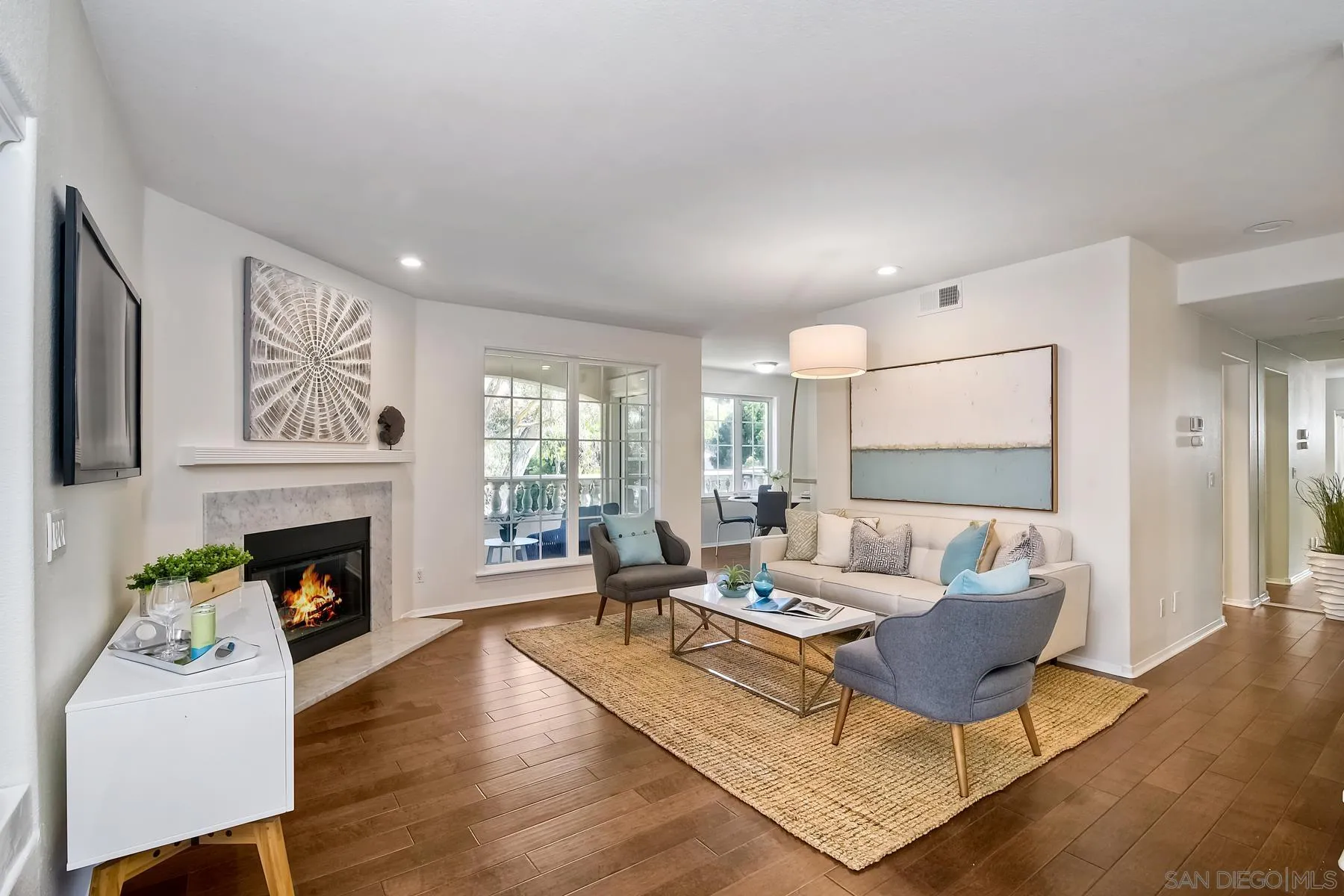 2872 Torrey Pines Road La Jolla, CA 92037 - Photo 7 of 34 a living room with furniture fireplace and wooden floor