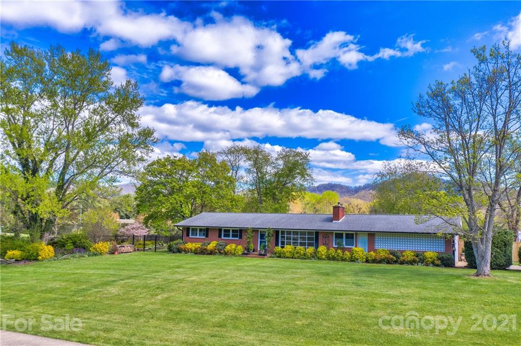208 Wells Road Canton, NC 28716 - Photo 2 of 35 a view of a house with a big yard