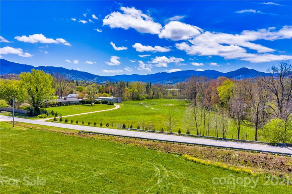 208 Wells Road Canton, NC 28716 - Photo 11 of 35 a view of a golf course with a swimming pool