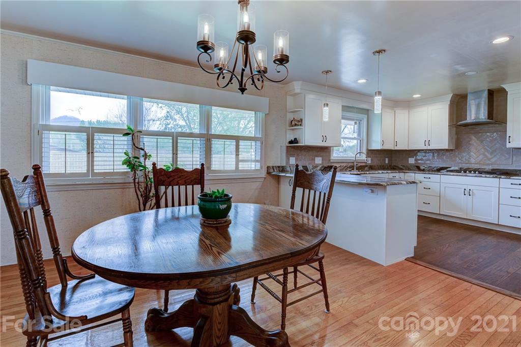 208 Wells Road Canton, NC 28716 - Photo 20 of 35 a view of a dining room with furniture window and outside view