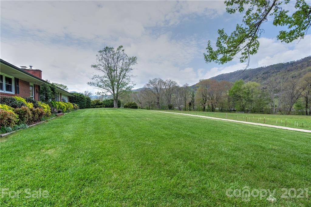 208 Wells Road Canton, NC 28716 - Photo 3 of 35 a big yard with lots of green space