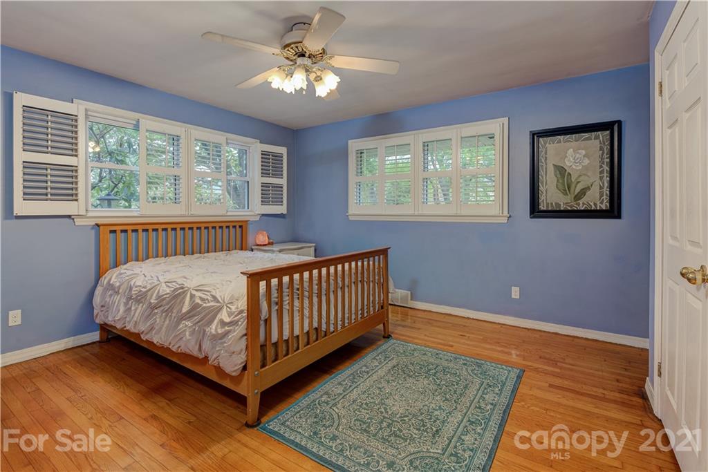 208 Wells Road Canton, NC 28716 - Photo 27 of 35 a bedroom with a bed and window