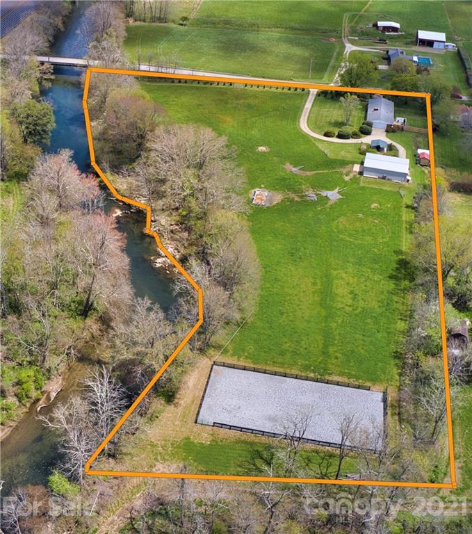 208 Wells Road Canton, NC 28716 - Photo 10 of 35 a view of a swimming pool with a yard