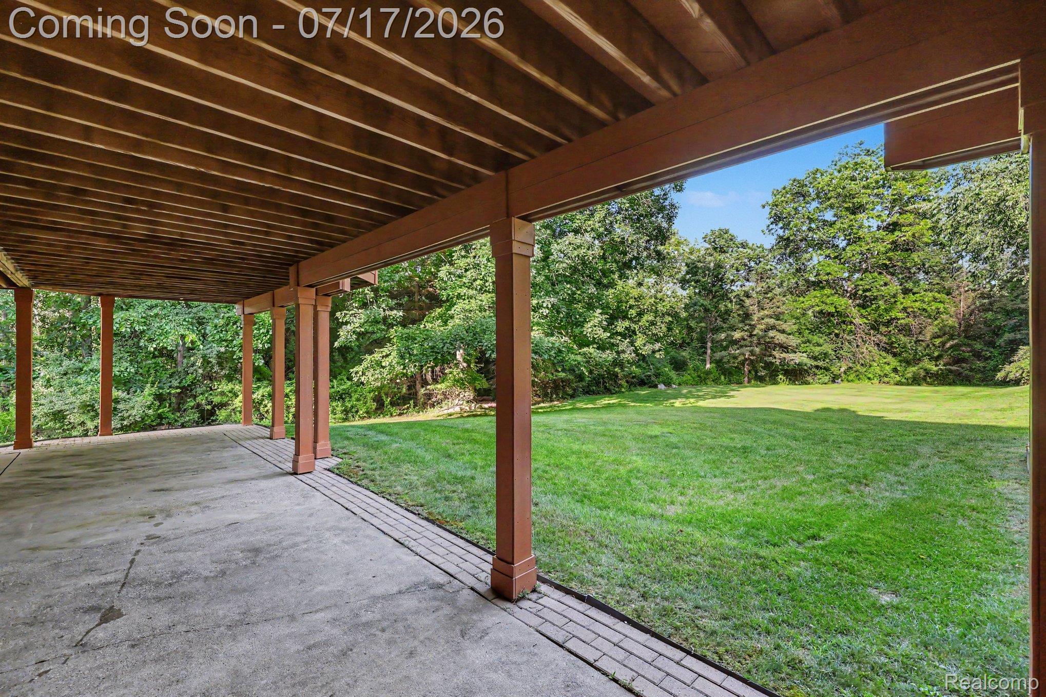 5685 Paint Valley Drive Rochester, MI 48306 - Photo 42 of 66 Covered patio featuring concrete flooring and a brick border