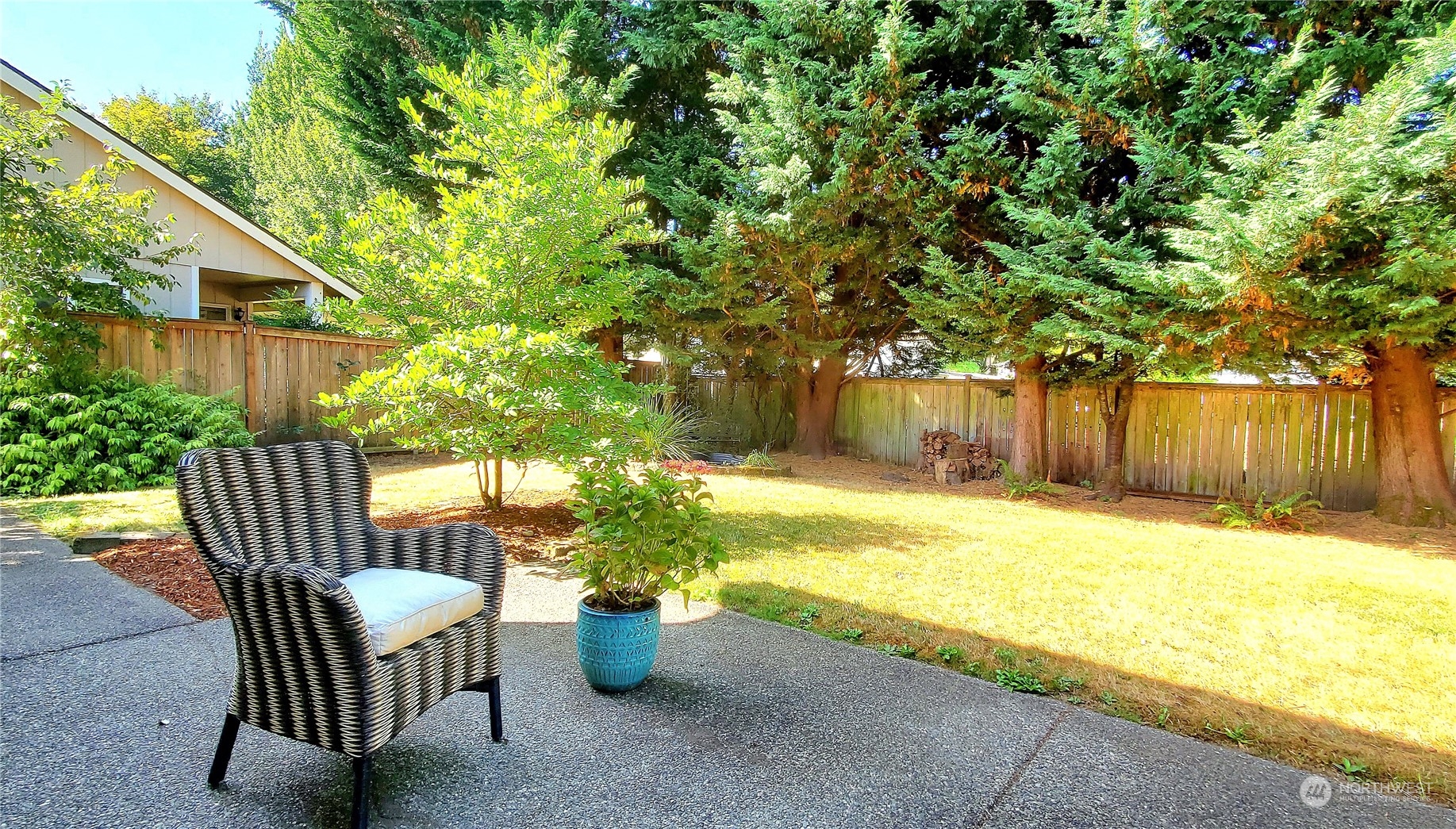 5451 Park Pl Loop Southeast Lacey, WA 98503 - Photo 14 of 36 a view of a patio with table and chairs and wooden fence