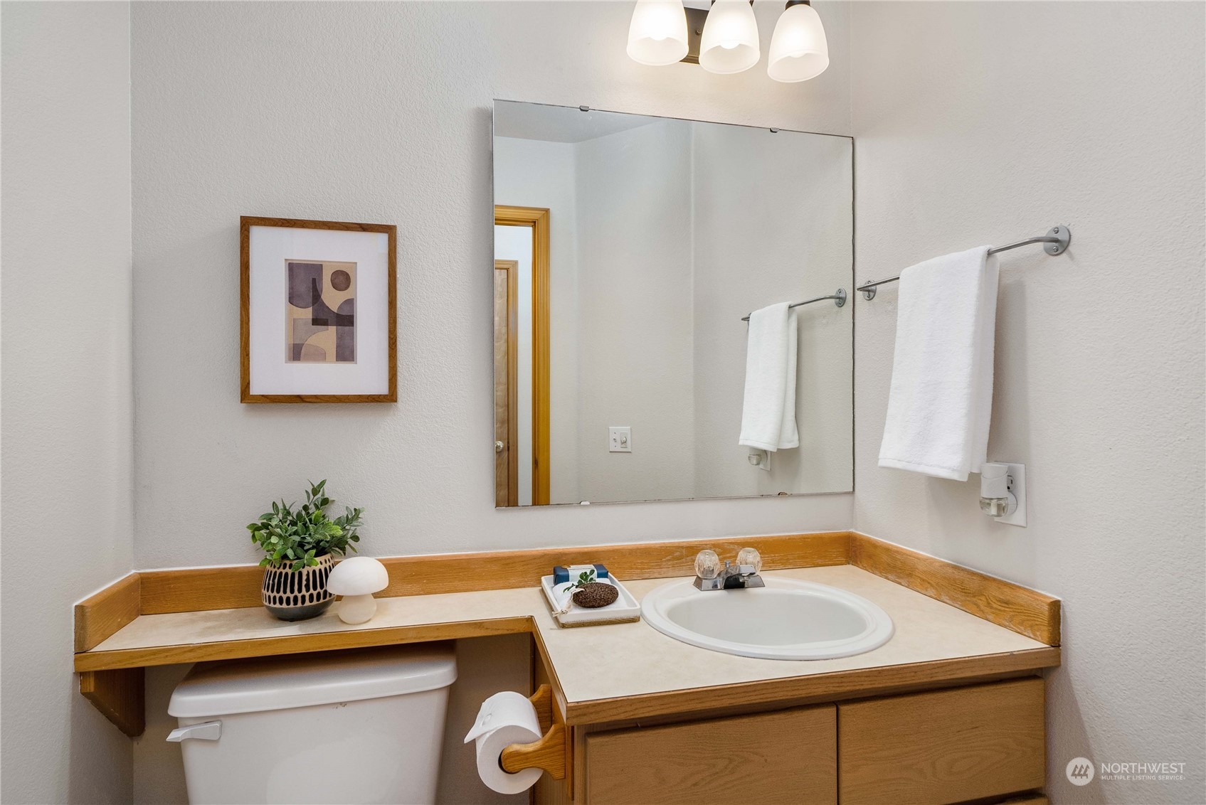 5451 Park Pl Loop Southeast Lacey, WA 98503 - Photo 16 of 36 a bathroom with a sink and a mirror