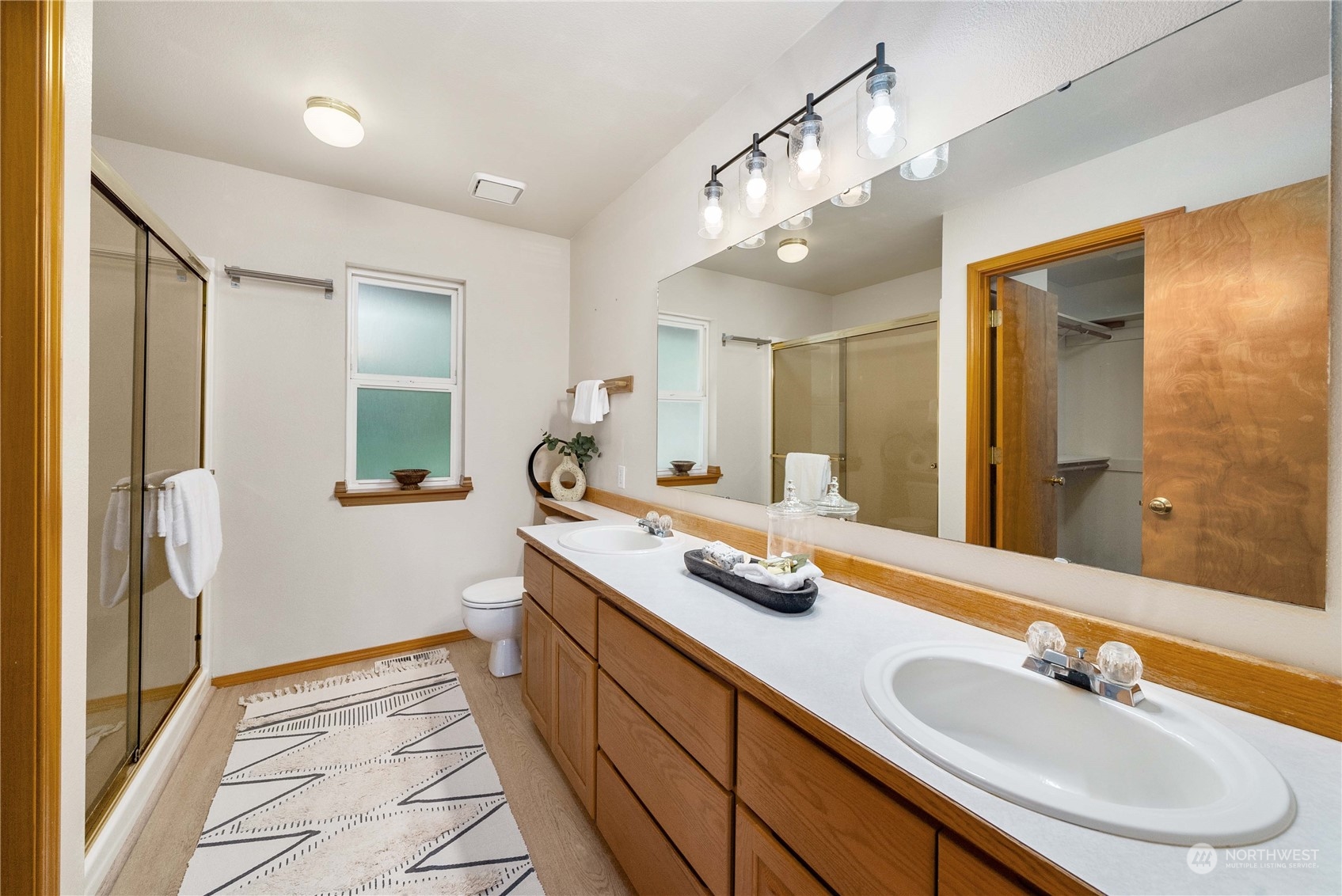 5451 Park Pl Loop Southeast Lacey, WA 98503 - Photo 19 of 36 a bathroom with a double vanity sink mirror and double