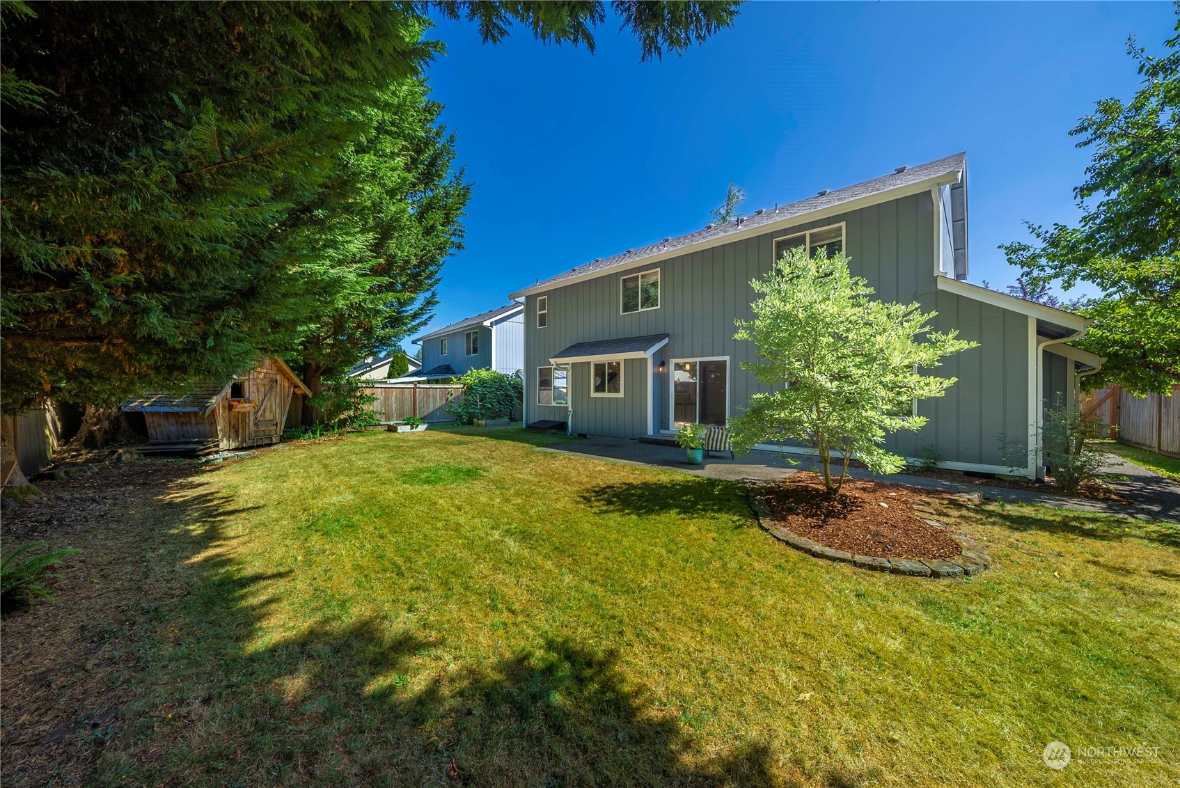 5451 Park Pl Loop Southeast Lacey, WA 98503 - Photo 25 of 36 a backyard of a house with plants and tree