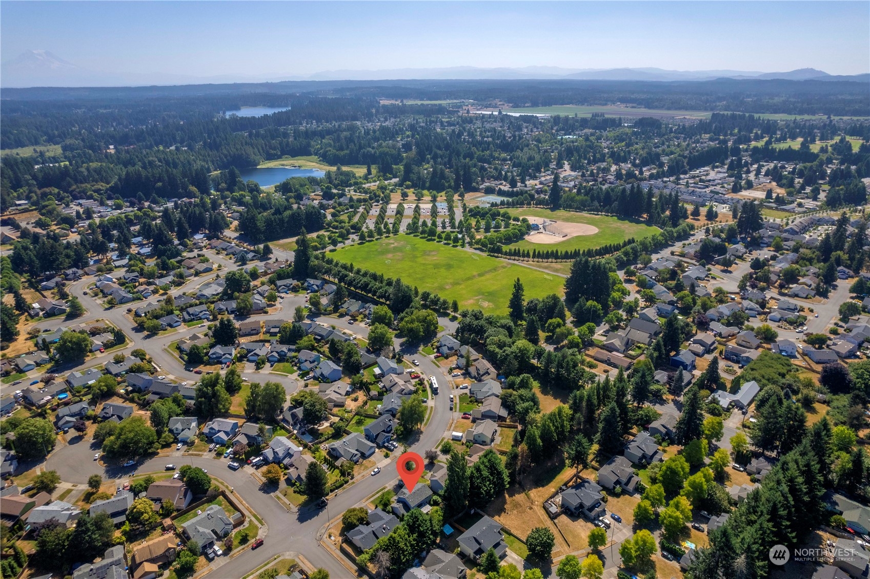 5451 Park Pl Loop Southeast Lacey, WA 98503 - Photo 35 of 36 an aerial view of a houses with a swimming pool