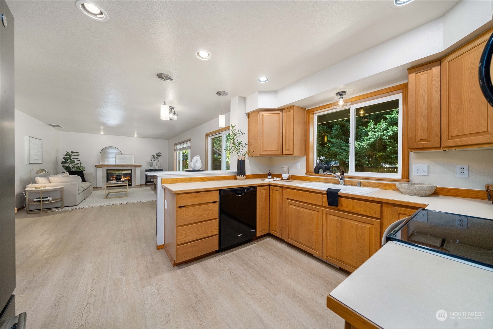 5451 Park Pl Loop Southeast Lacey, WA 98503 - Photo 10 of 36 a kitchen that has a sink and a stove in it