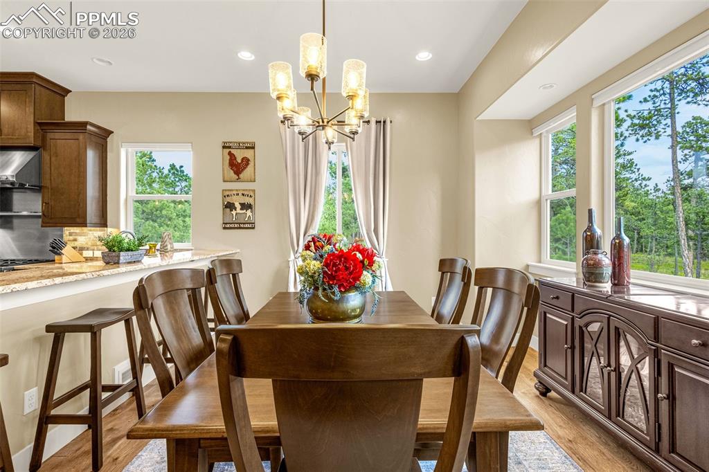 1325 Boldmere Court Monument, CO 80132 - Photo 14 of 49 a view of a dining room with furniture window and outside view