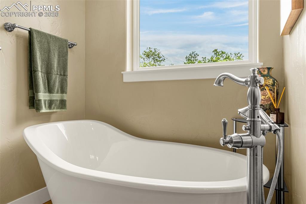 1325 Boldmere Court Monument, CO 80132 - Photo 21 of 49 a white bath tub sitting next to a window