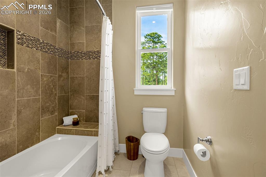 1325 Boldmere Court Monument, CO 80132 - Photo 28 of 49 a bathroom with a toilet a sink and bathtub