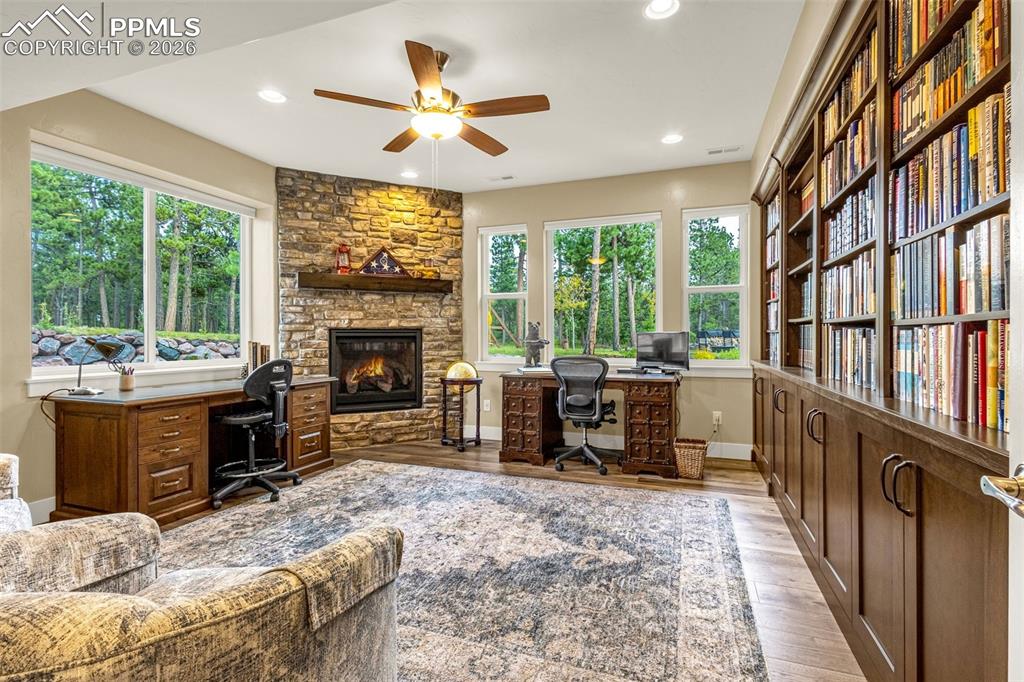 1325 Boldmere Court Monument, CO 80132 - Photo 35 of 49 a living room with furniture a window and a fireplace
