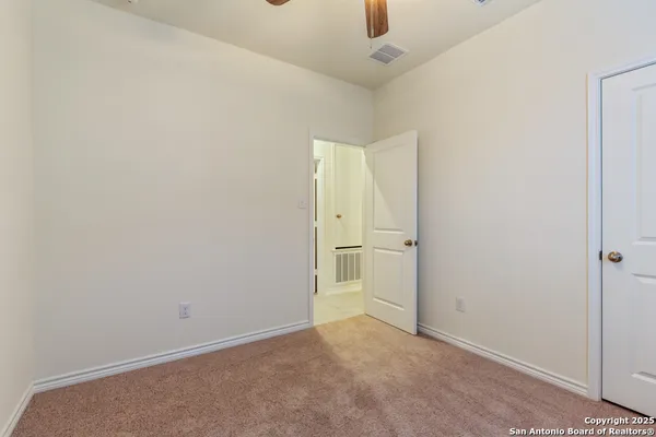 an empty room with a bathroom