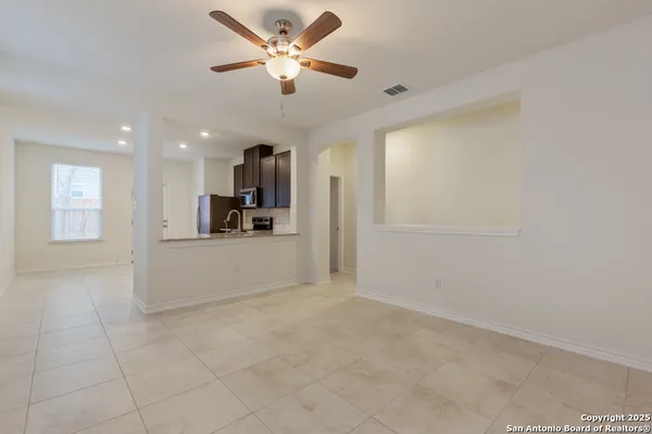 a view of a kitchen with a sink and a window