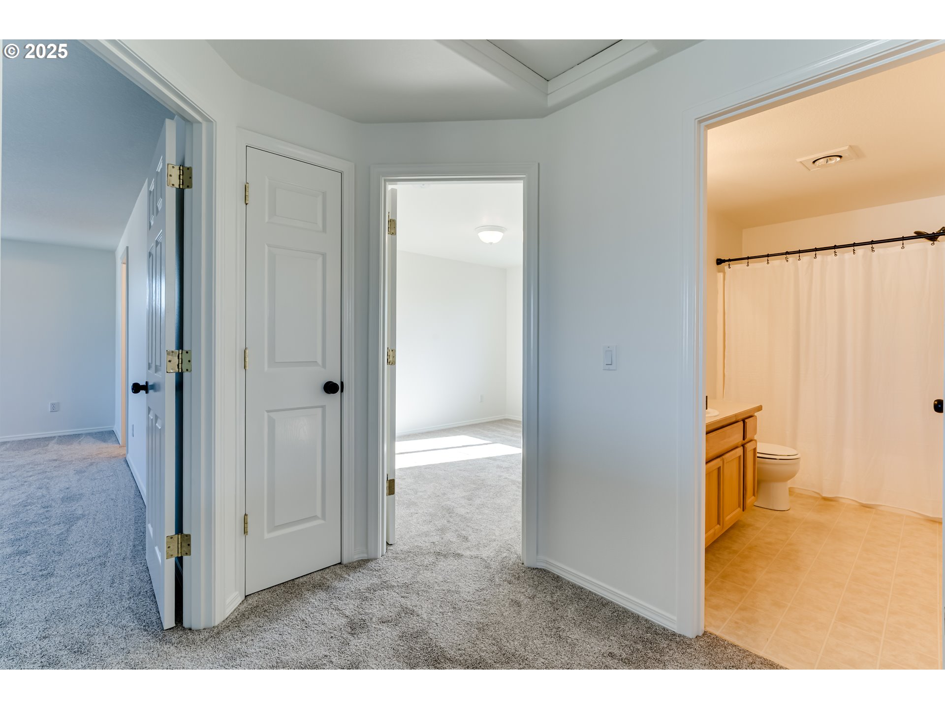 1255 Brower Avenue Eugene, OR 97402 - Photo 27 of 39 a view of a bathroom with a walk in closet and wooden floor