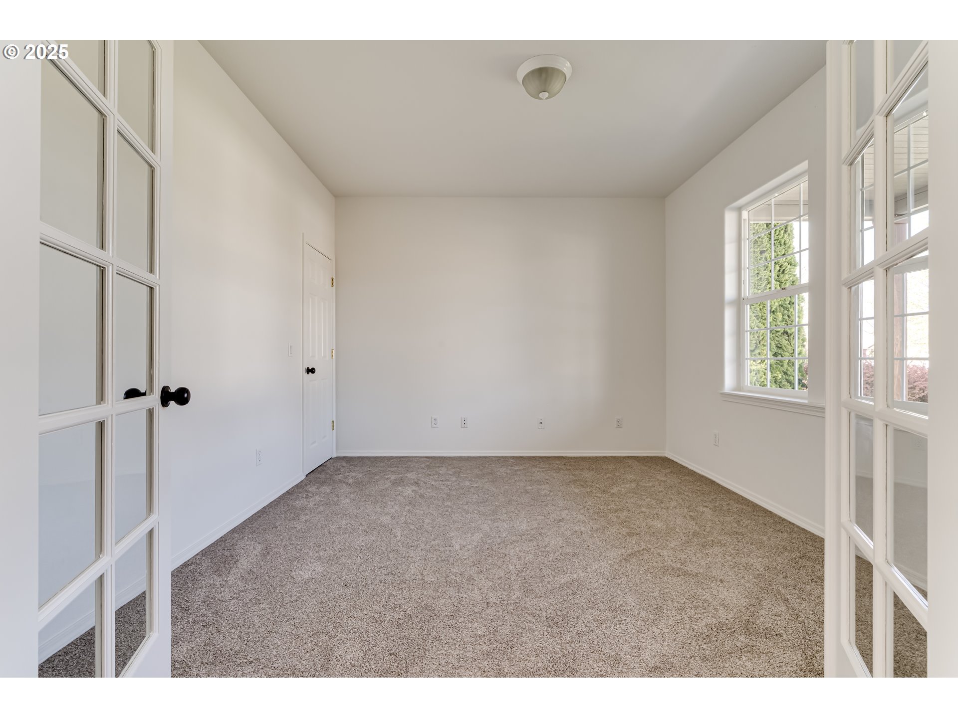 1255 Brower Avenue Eugene, OR 97402 - Photo 7 of 39 a view of an empty room with a window