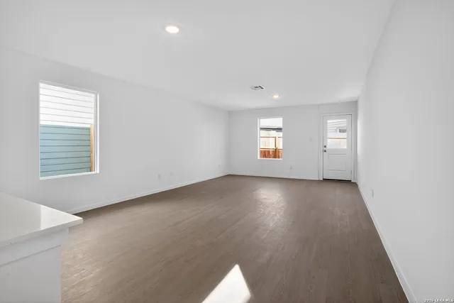 an empty room with windows