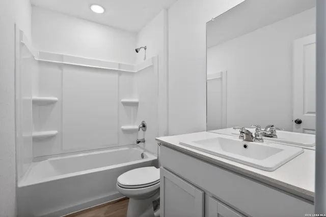 a bathroom with a sink a toilet and a bathtub