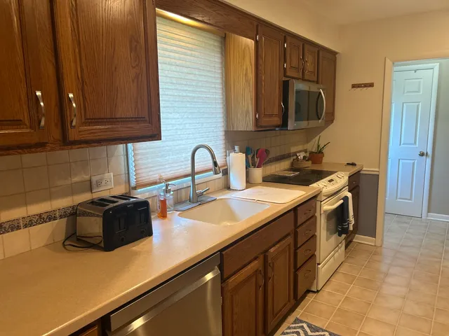 a kitchen with a sink and cabinets