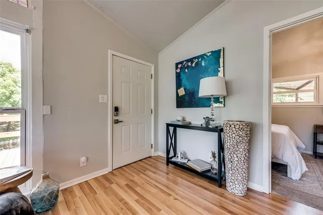 a living room with a bed furniture and a window