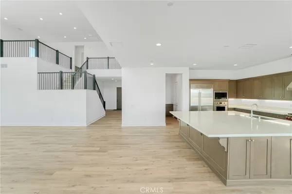 a view of staircase with lots of windows and wooden floor