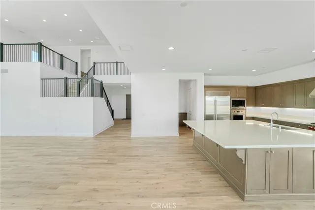 a view of staircase with lots of windows and wooden floor