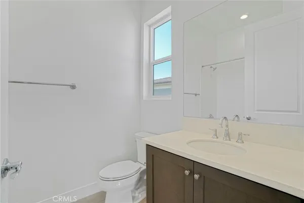 a view of staircase with lots of wooden floor and a window